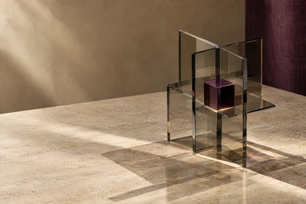 Insight Cipher — Connected Perspective Glass forms and a plum cube on warm stone, representing a connected financial perspective.